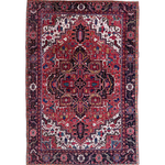 Persian Heriz rug with central crimson medallion, navy accents, and ornate border