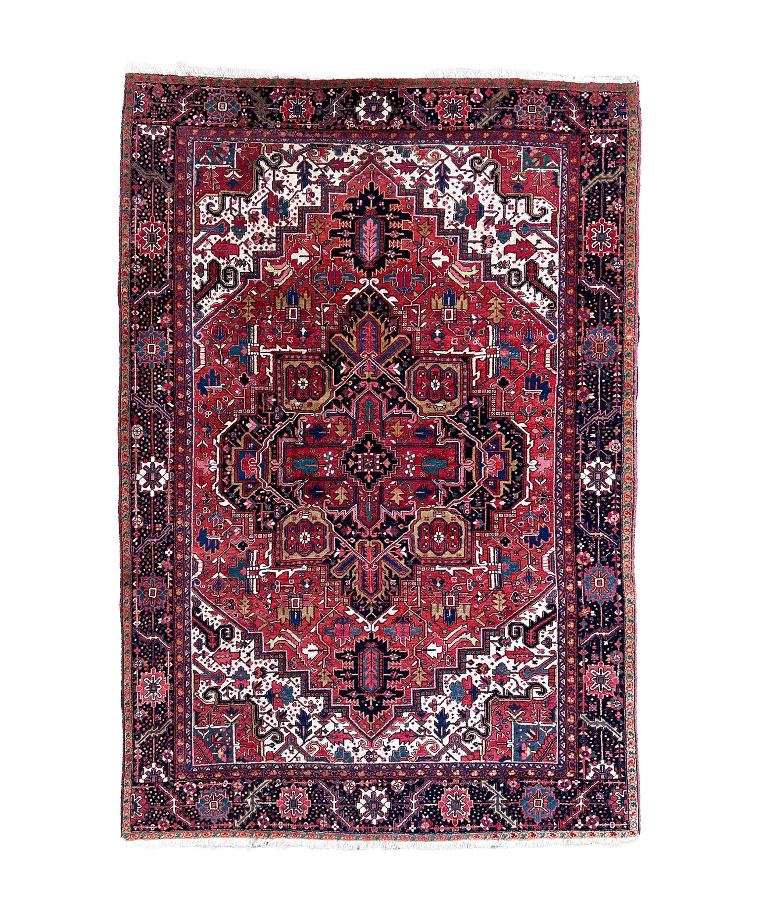 Persian Heriz rug with central crimson medallion, navy accents, and ornate border