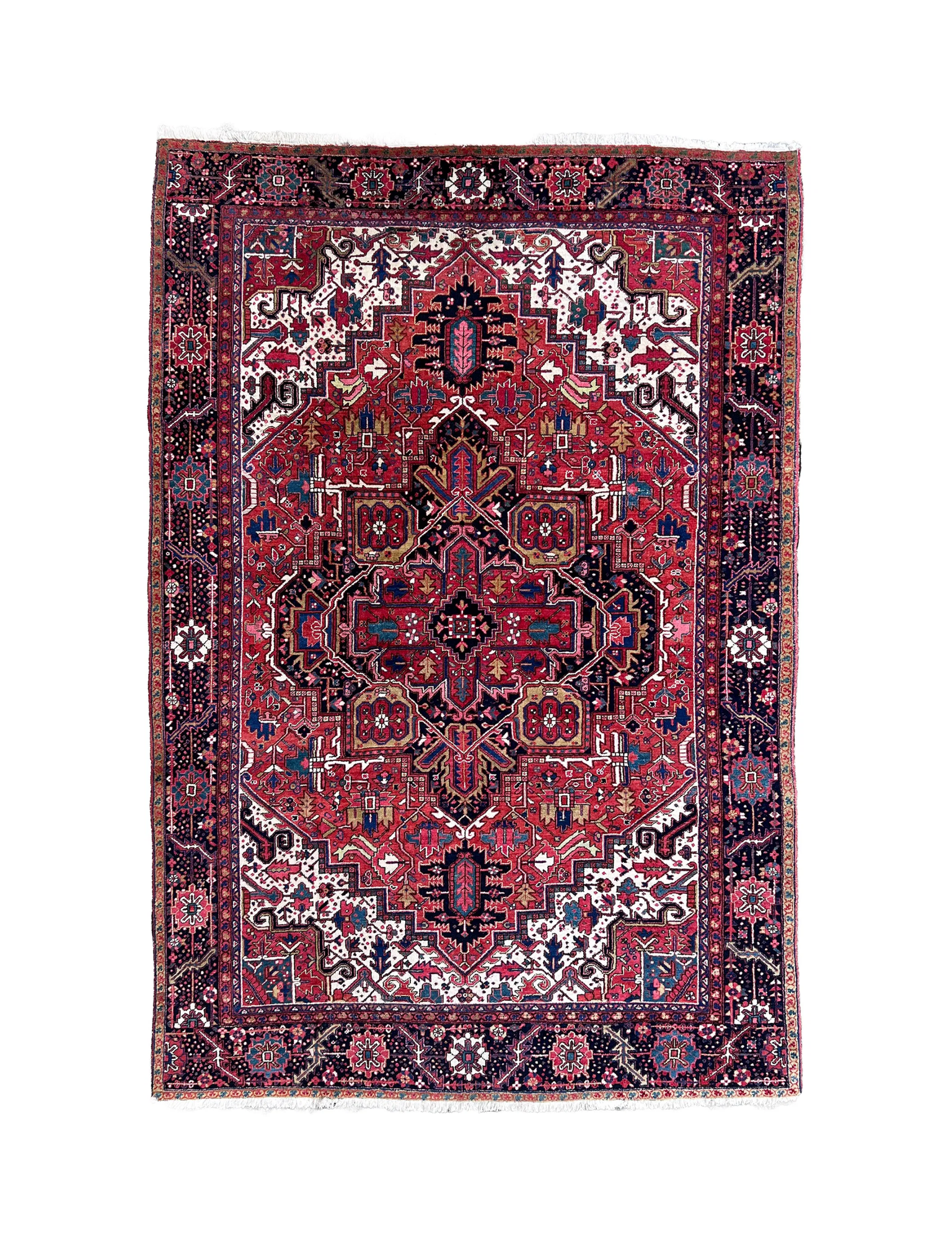 Persian Heriz rug with central crimson medallion, navy accents, and ornate border
