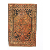 Persian Hamadan rug with rust orange field, navy geometric medallion, fringed edges