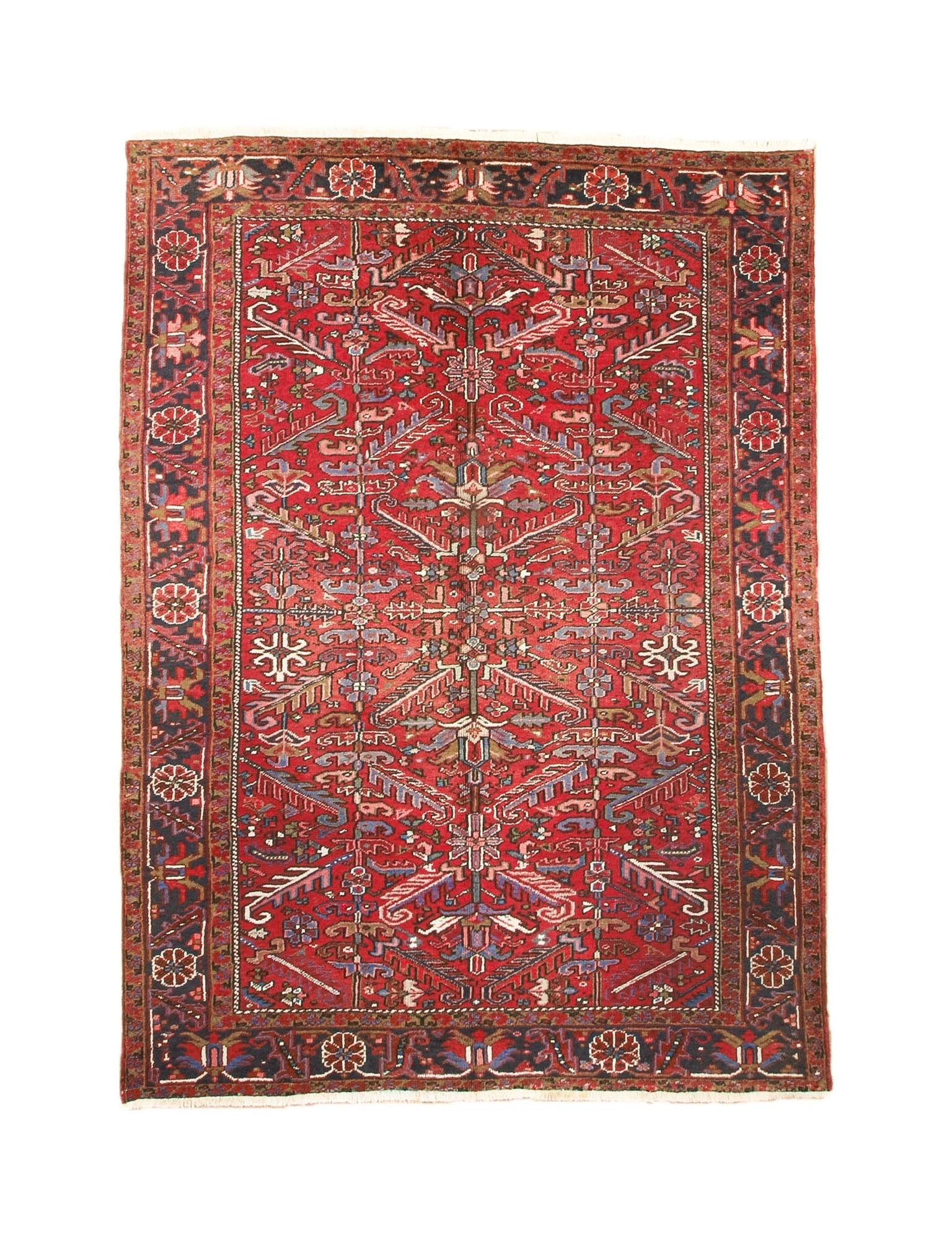 Red Persian-style Heriz rug with central medallion, ornate border, and cream accents