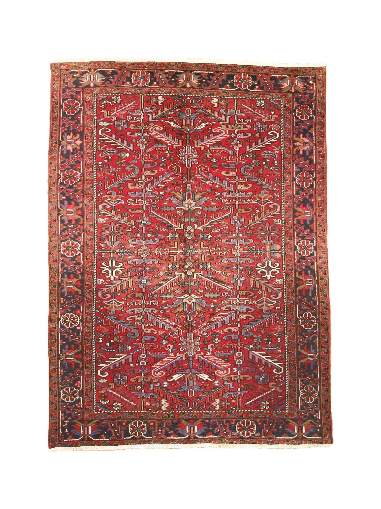 Red Persian-style Heriz rug with central medallion, ornate border, and cream accents