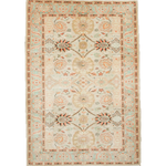 Sultanabad rug with cream ground, coral and teal floral medallions, fringed border