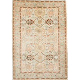 Sultanabad rug with cream ground, coral and teal floral medallions, fringed border