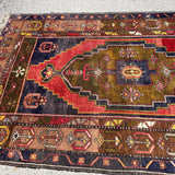Vintage Turkish Yahyali Rug — Olive & Indigo Stepped Medallion. Additional original photograph showing the rug's surface, design and weave. SKU 12407024.