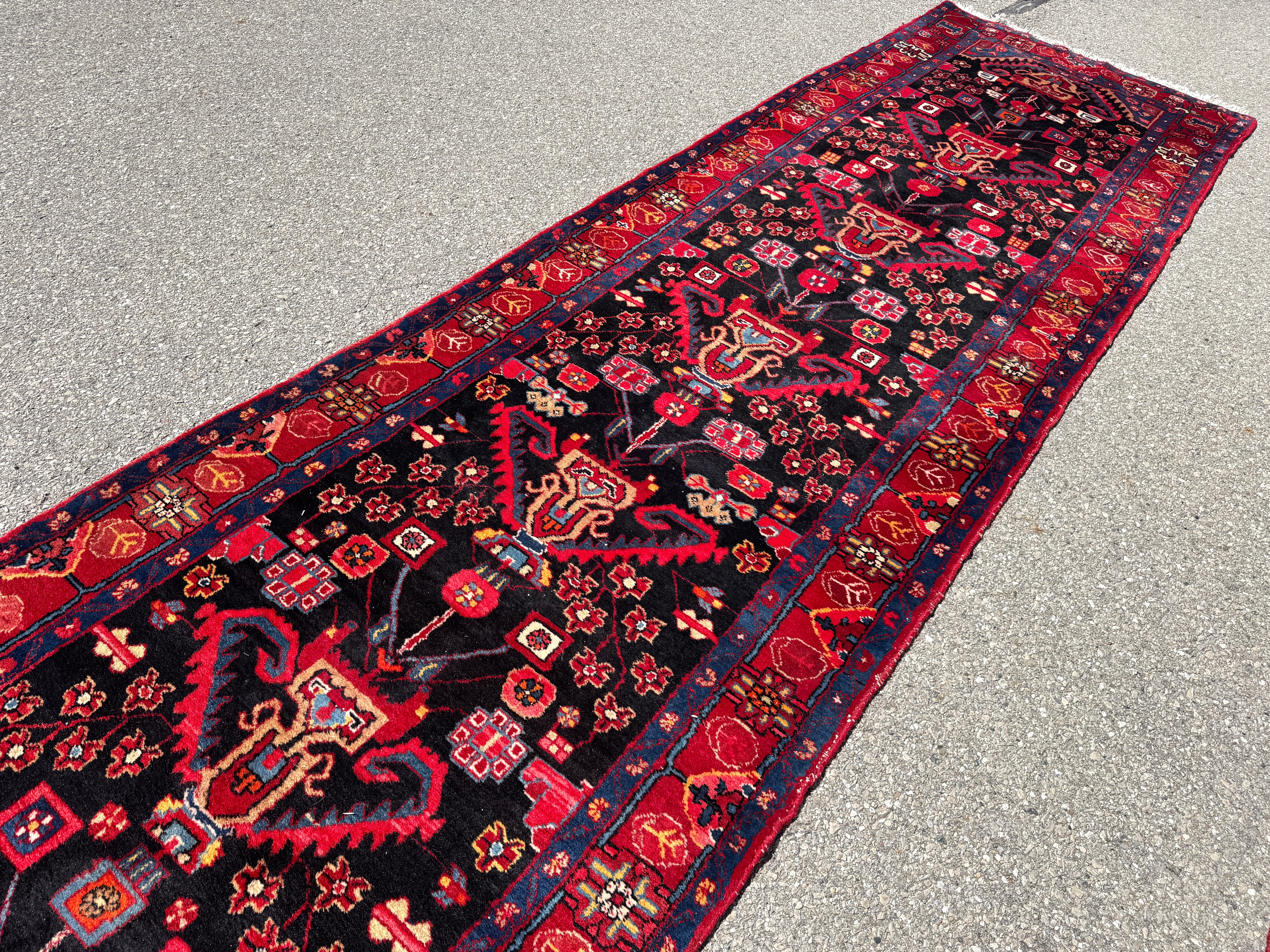 Vintage Nahavand Runner — Scarlet Florals on Midnight Blue. Additional original photograph showing the rug's surface, design and weave. SKU 2121.