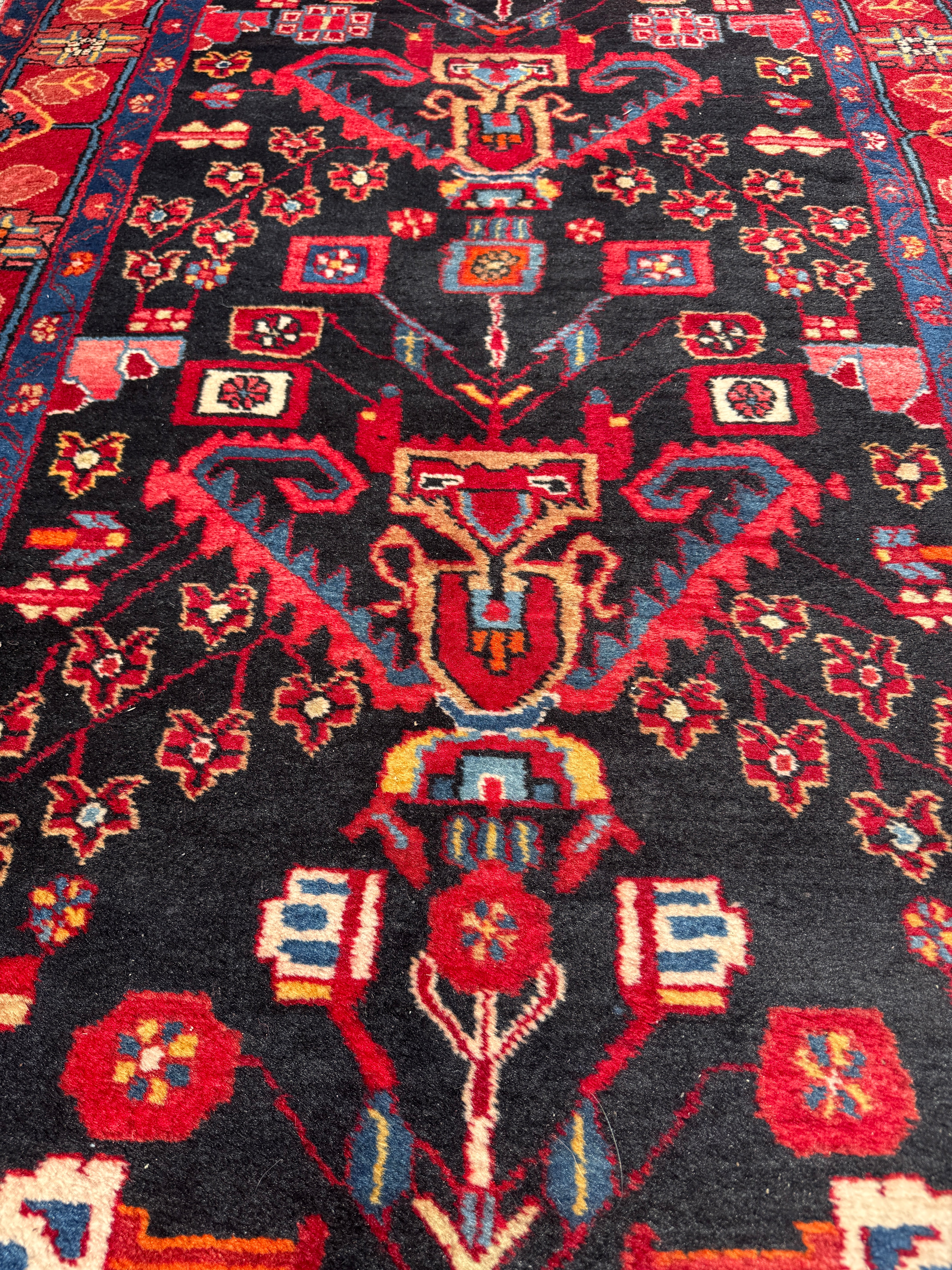 Vintage Nahavand Runner — Scarlet Florals on Midnight Blue. Additional original photograph showing the rug's surface, design and weave. SKU 2121.