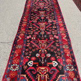 Vintage Nahavand Runner — Scarlet Florals on Midnight Blue. Additional original photograph showing the rug's surface, design and weave. SKU 2121.