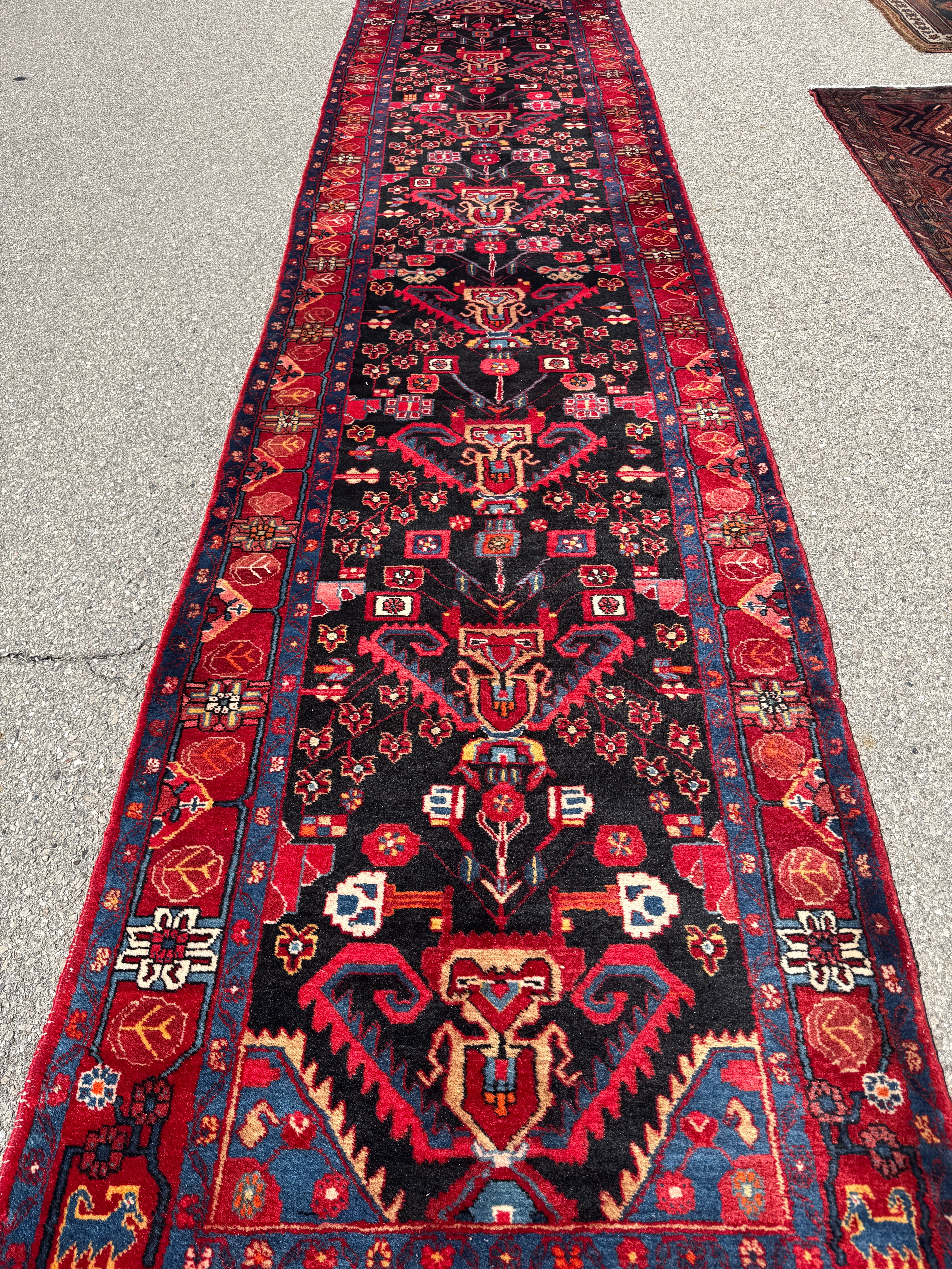 Vintage Nahavand Runner — Scarlet Florals on Midnight Blue. Additional original photograph showing the rug's surface, design and weave. SKU 2121.