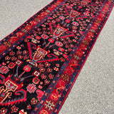 Vintage Nahavand Runner — Scarlet Florals on Midnight Blue. Additional original photograph showing the rug's surface, design and weave. SKU 2121.