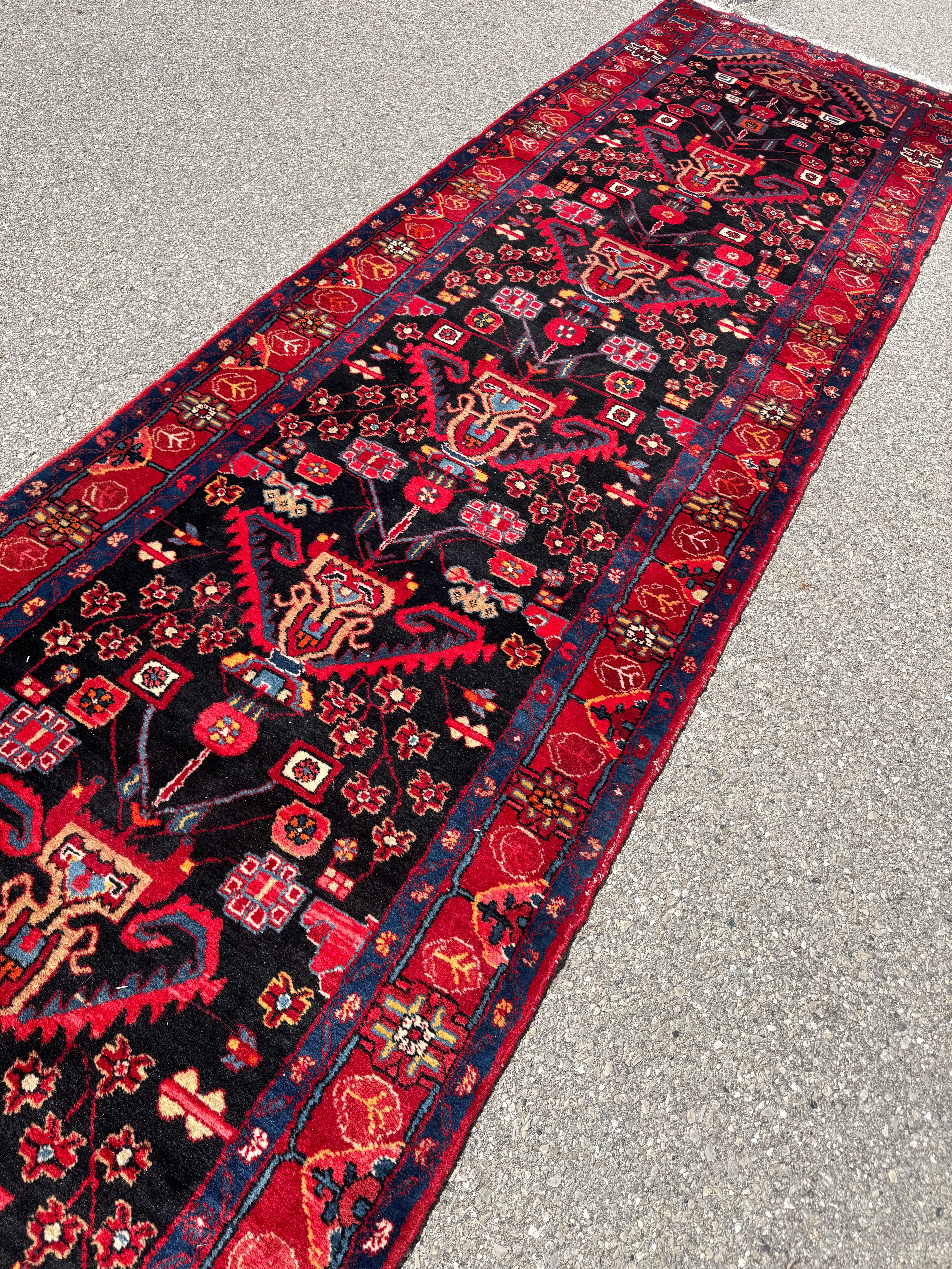 Vintage Nahavand Runner — Scarlet Florals on Midnight Blue. Additional original photograph showing the rug's surface, design and weave. SKU 2121.