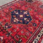 Vintage Tuyserkan Rug — Scarlet & Indigo Star Medallion. Additional original photograph showing the rug's surface, design and weave. SKU 52501024.