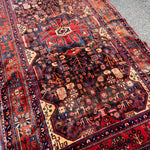 Vintage Nahavand Rug — Burnt Sienna & Indigo Village Motifs. Additional original photograph showing the rug's surface, design and weave. SKU 52507103.