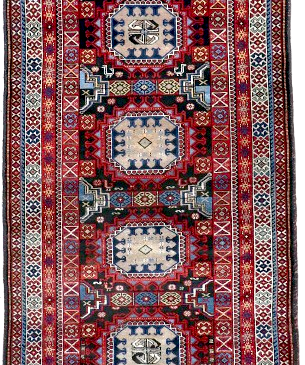 Semi-antique runner rug with red, blue and cream geometric medallion pattern