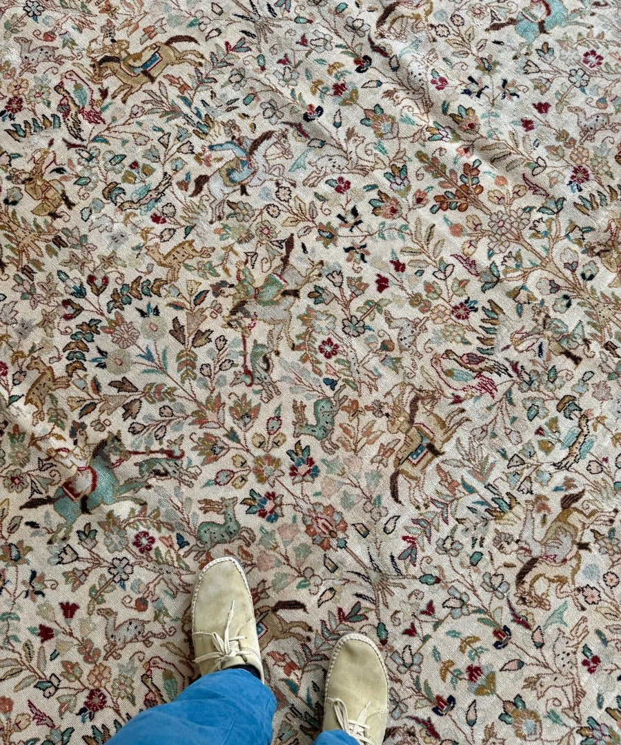 Tabriz Tabatabai rug with ivory floral vines and multicolor birds motif