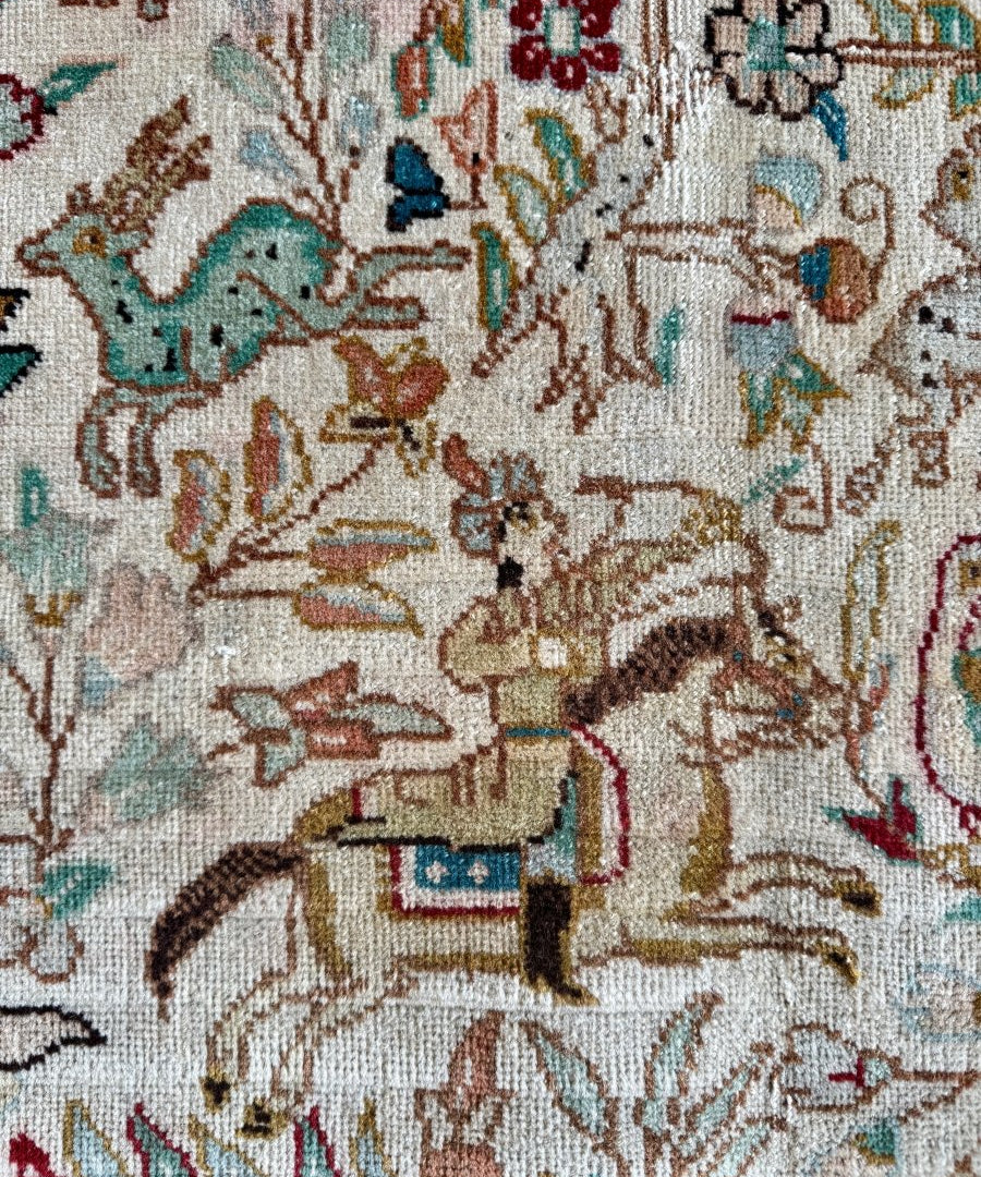 Tabriz Tabatabai rug close-up: ivory field with multicolor garden motifs and birds