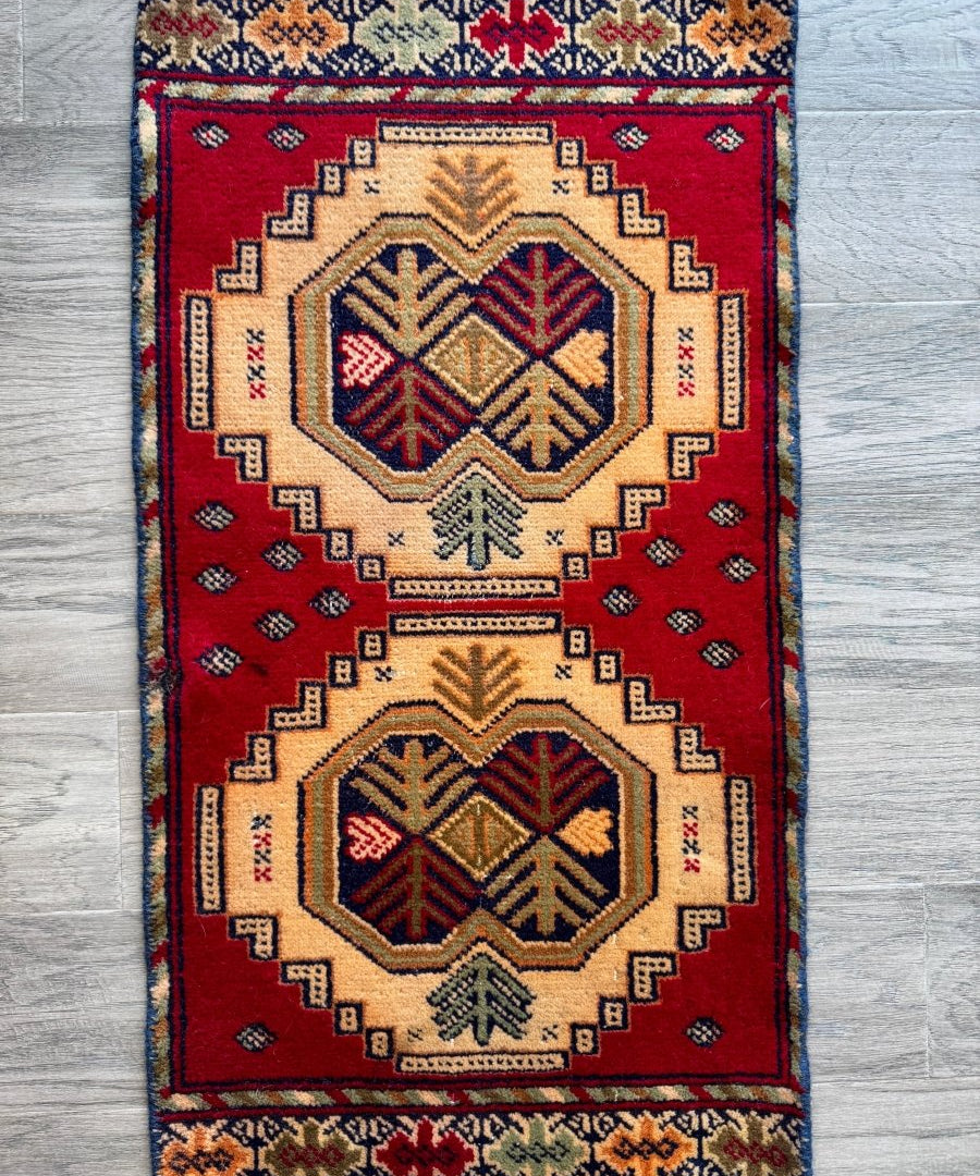 Turkmen mini rug in red and cream with geometric medallions and border, 1'5"x2'7"