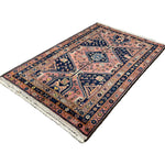 Vintage Afshar Luri Rug, angled view showing the full field and borders, hand-knotted wool pile. SKU RR 32536.