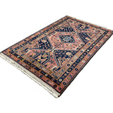 Vintage Afshar Luri Rug, angled view showing the full field and borders, hand-knotted wool pile. SKU RR 32536.