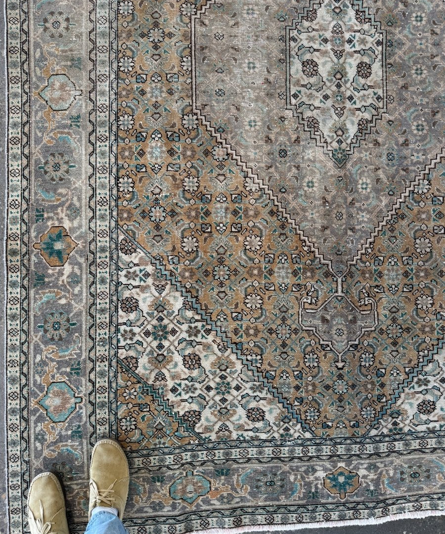 Ardabil-style vintage rug with light gray field, blue accents, and central medallion