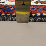 Vintage Chaleshtor Bakhtiari Rug, side-on pile and edge detail with a ruler, hand-knotted wool pile. SKU 108870.