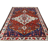 Vintage Chaleshtor Bakhtiari Rug, full rug in perspective showing the patterned field and borders, hand-knotted wool pile. SKU 108870.