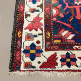 Vintage Chaleshtor Bakhtiari Rug, close-up of the patterned corner and edge, hand-knotted wool pile. SKU 108870.
