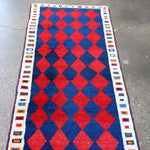 Rectangular Gabbeh rug with red and blue diamond grid and geometric border