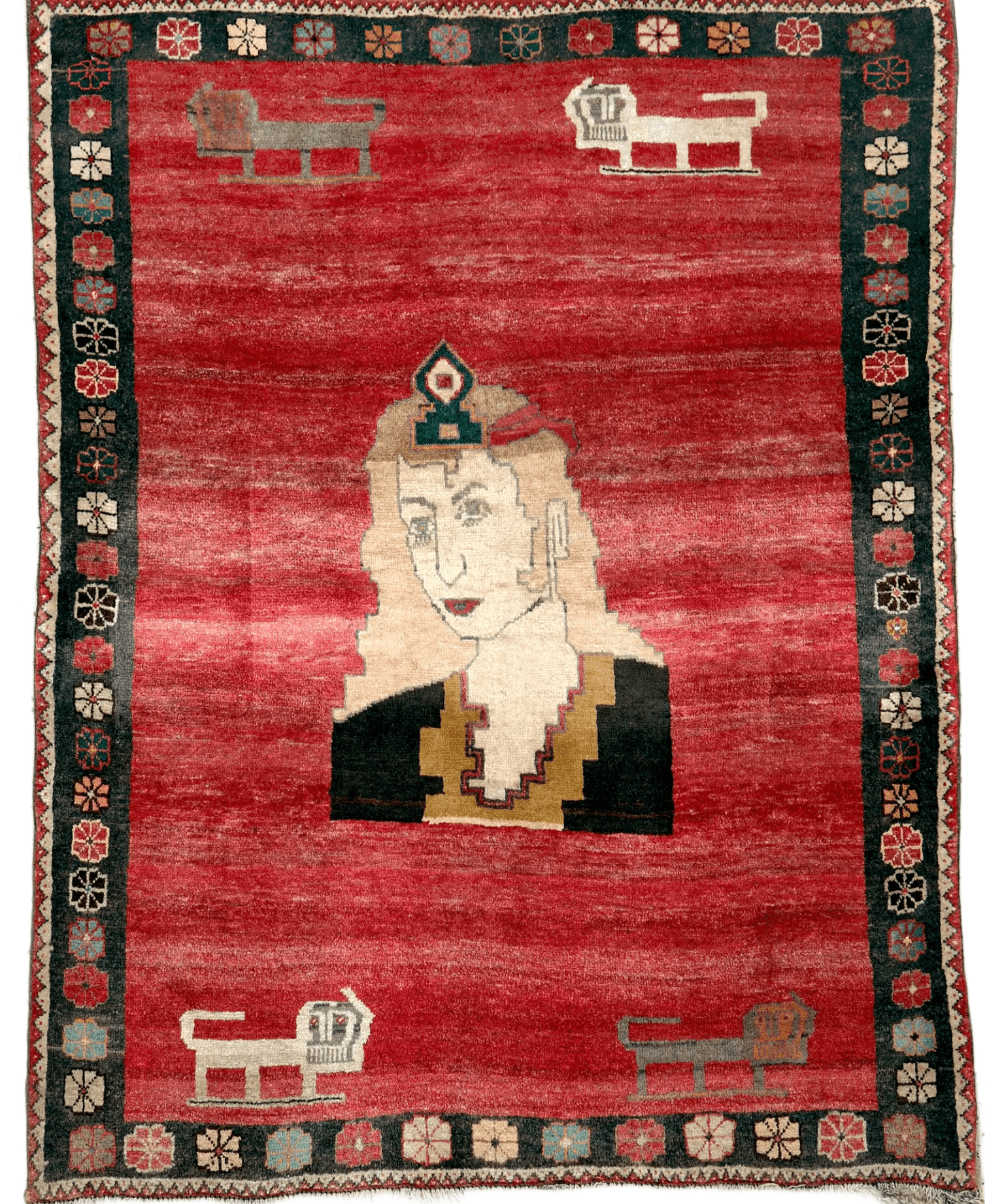 Vintage Persian Gabbeh rug with red field, cream face, dark clothing, and border motifs.