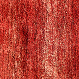 Red Persian Gabbeh rug surface texture in dense looped pile with subtle mottling.