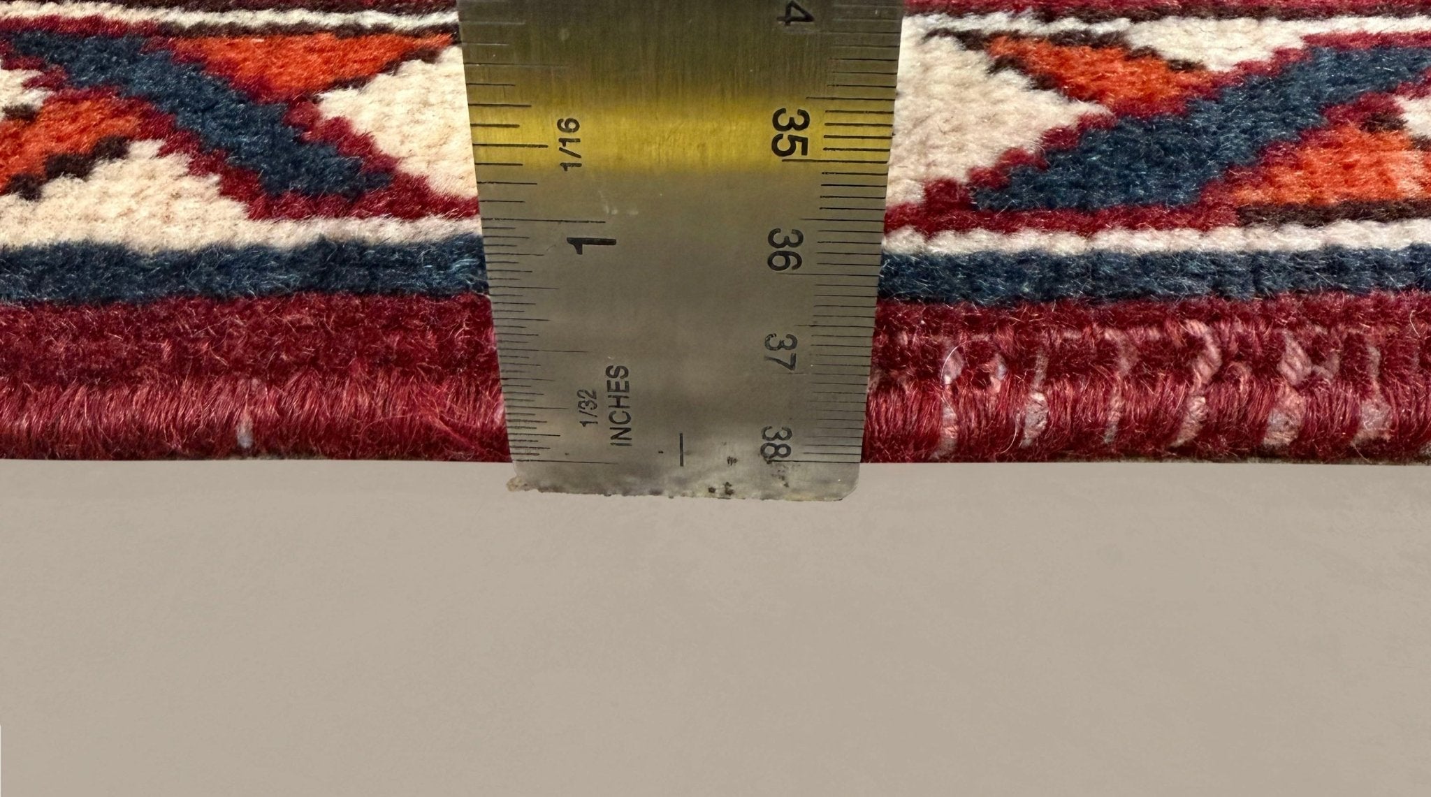 Vintage Saman Bakhtiari Rug, side-on pile and edge detail with a ruler, hand-knotted wool pile. SKU EE 1.1233.