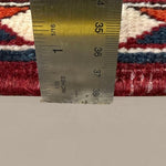 Vintage Saman Bakhtiari Rug, side-on pile and edge detail with a ruler, hand-knotted wool pile. SKU EE 1.1233.