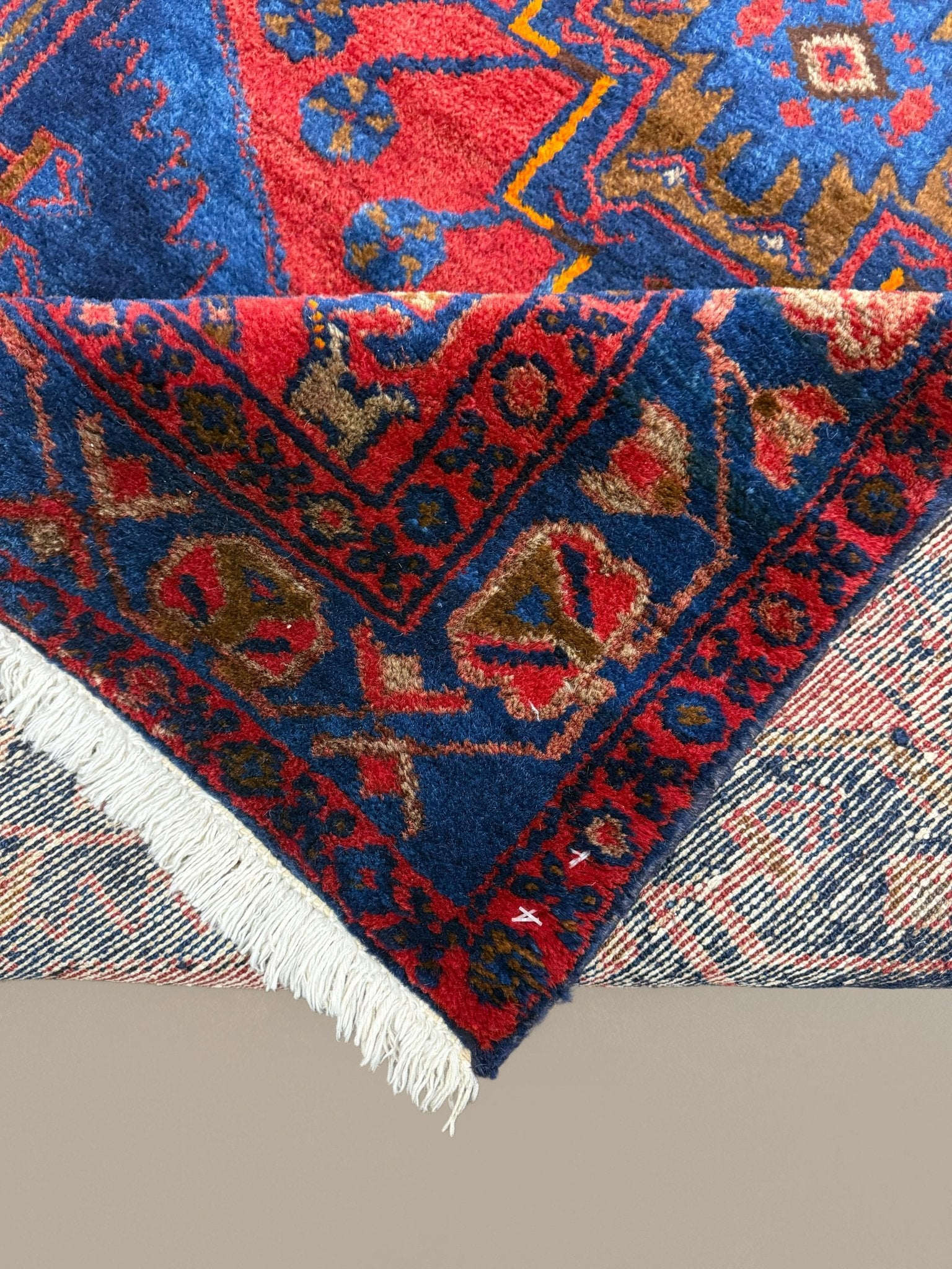 Persian Sonqor Runner, folded corner and reverse, hand-knotted wool with red colouring. SKU RR 30722.