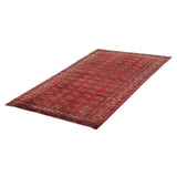 Vintage Turkmen Rug | 7' 1" x 10' 6" — angled view, gallery 01
