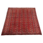 Vintage Turkmen Rug | 7' 1" x 10' 6" — angled view, gallery 02