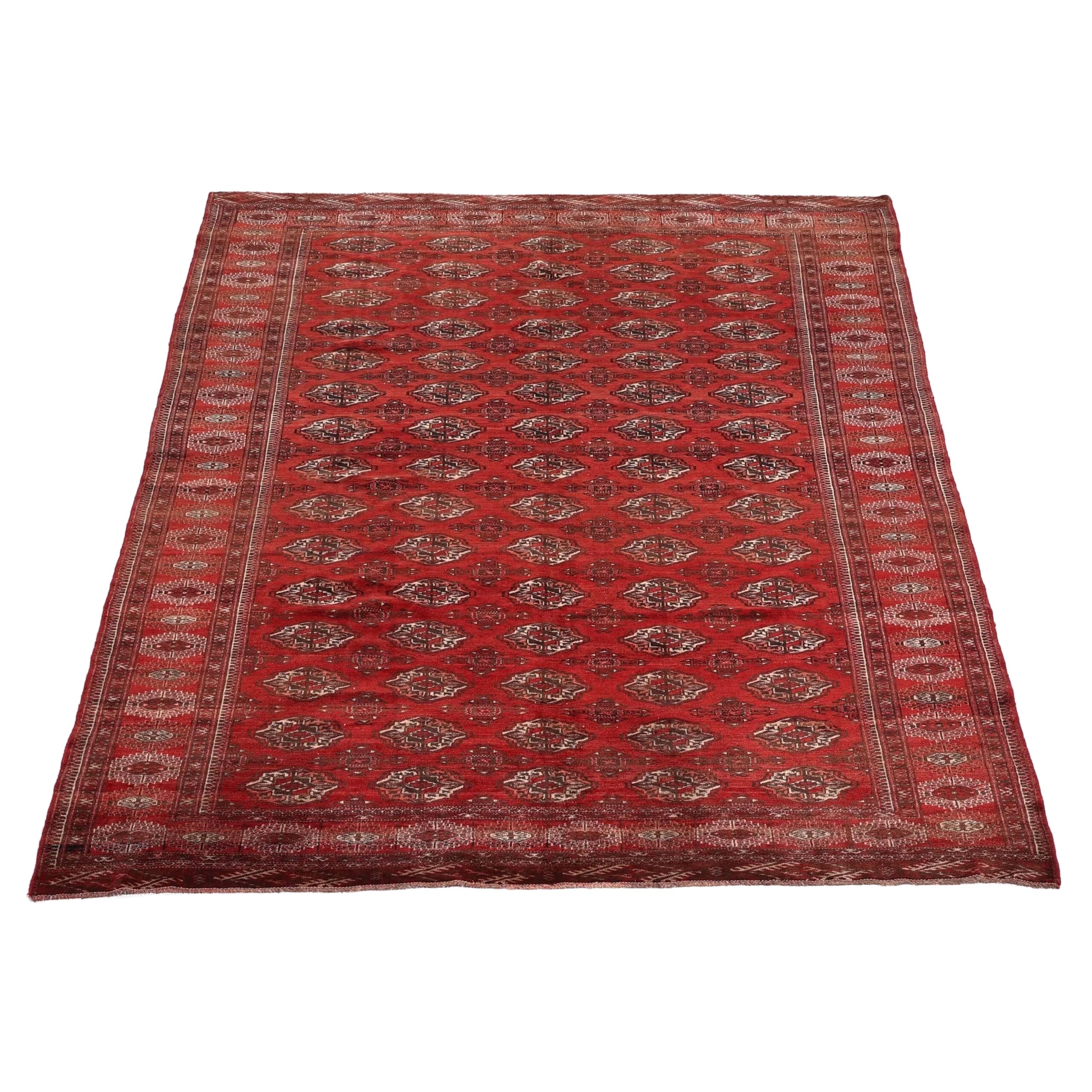 Vintage Turkmen Rug | 7' 1" x 10' 6" — angled view, gallery 02