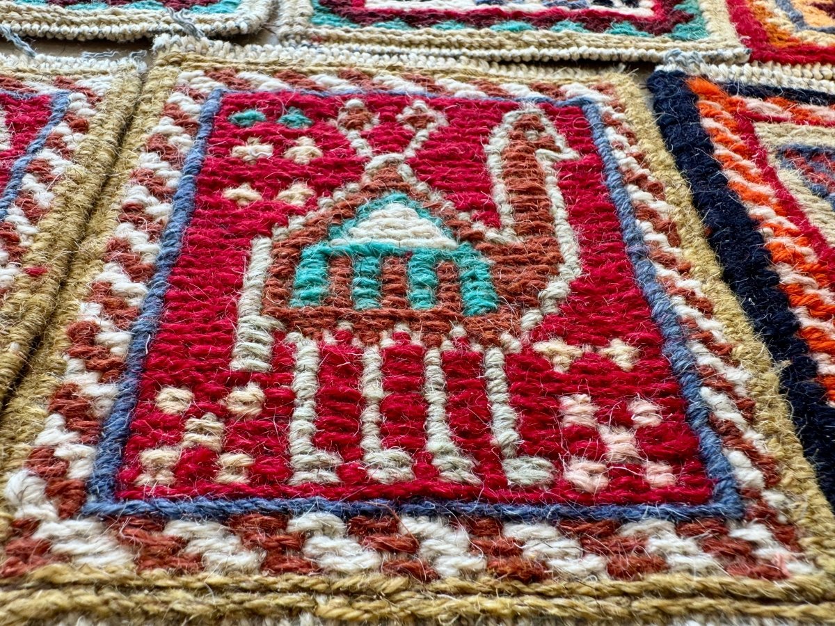 Square wool kilim coaster with red central design, blue and beige woven stripes