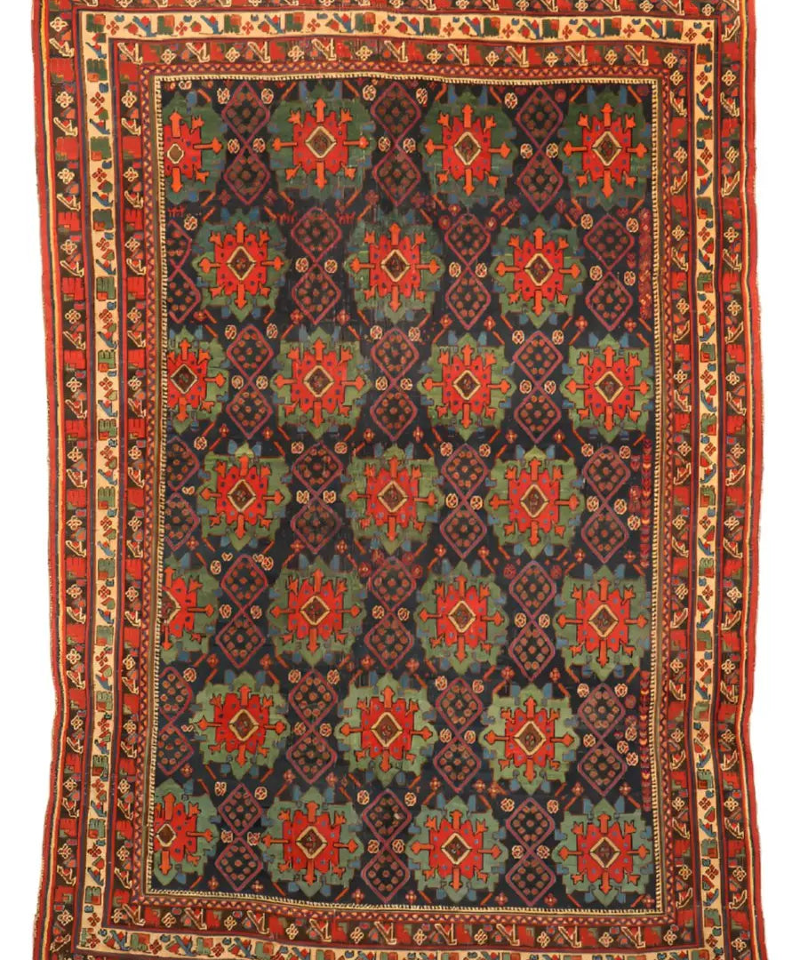 Antique Afshar rug flat view: dark blue, red and green diamond motifs with cream border