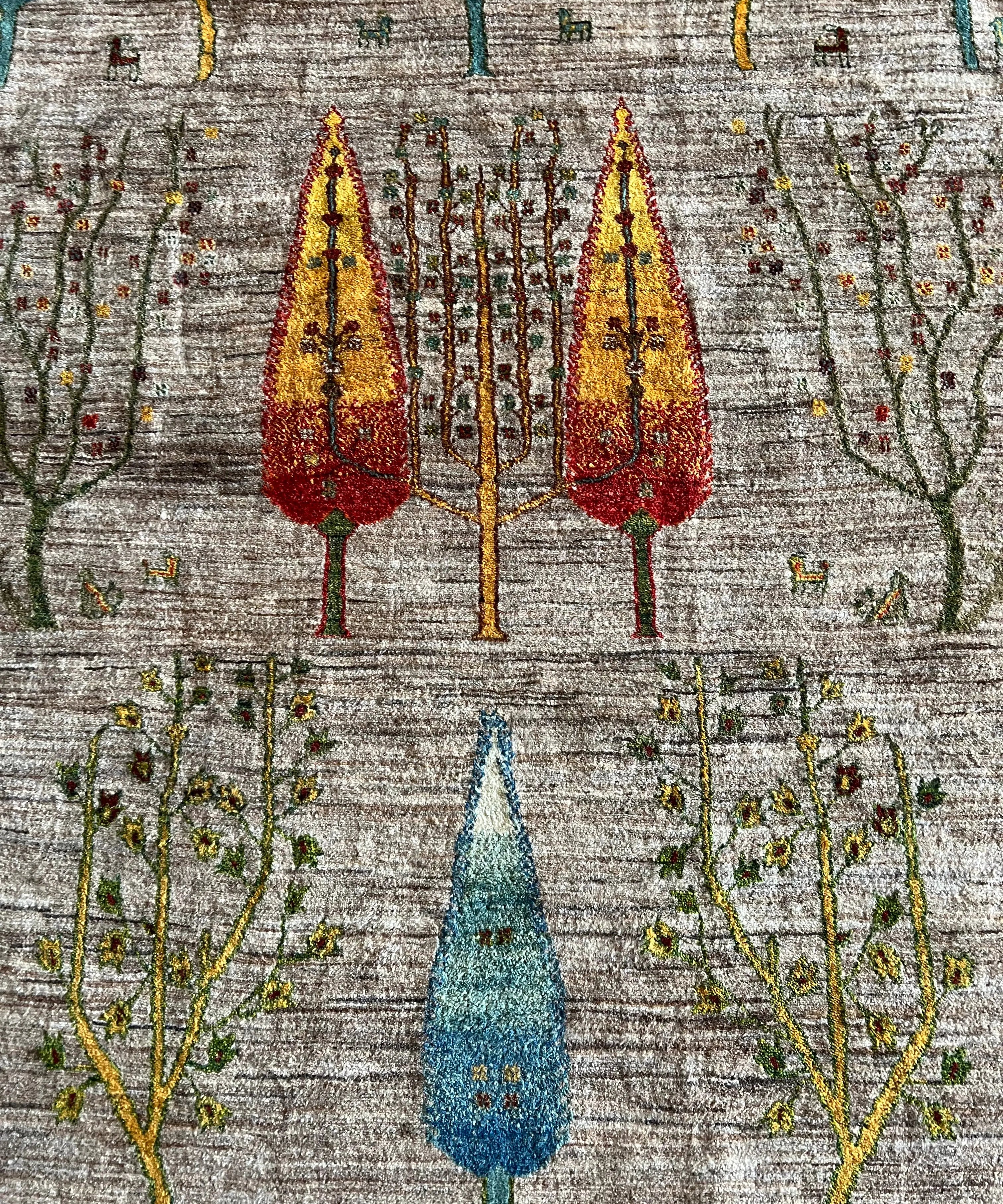 Area rug pattern with tall red and blue trees and scattered vines on light ground
