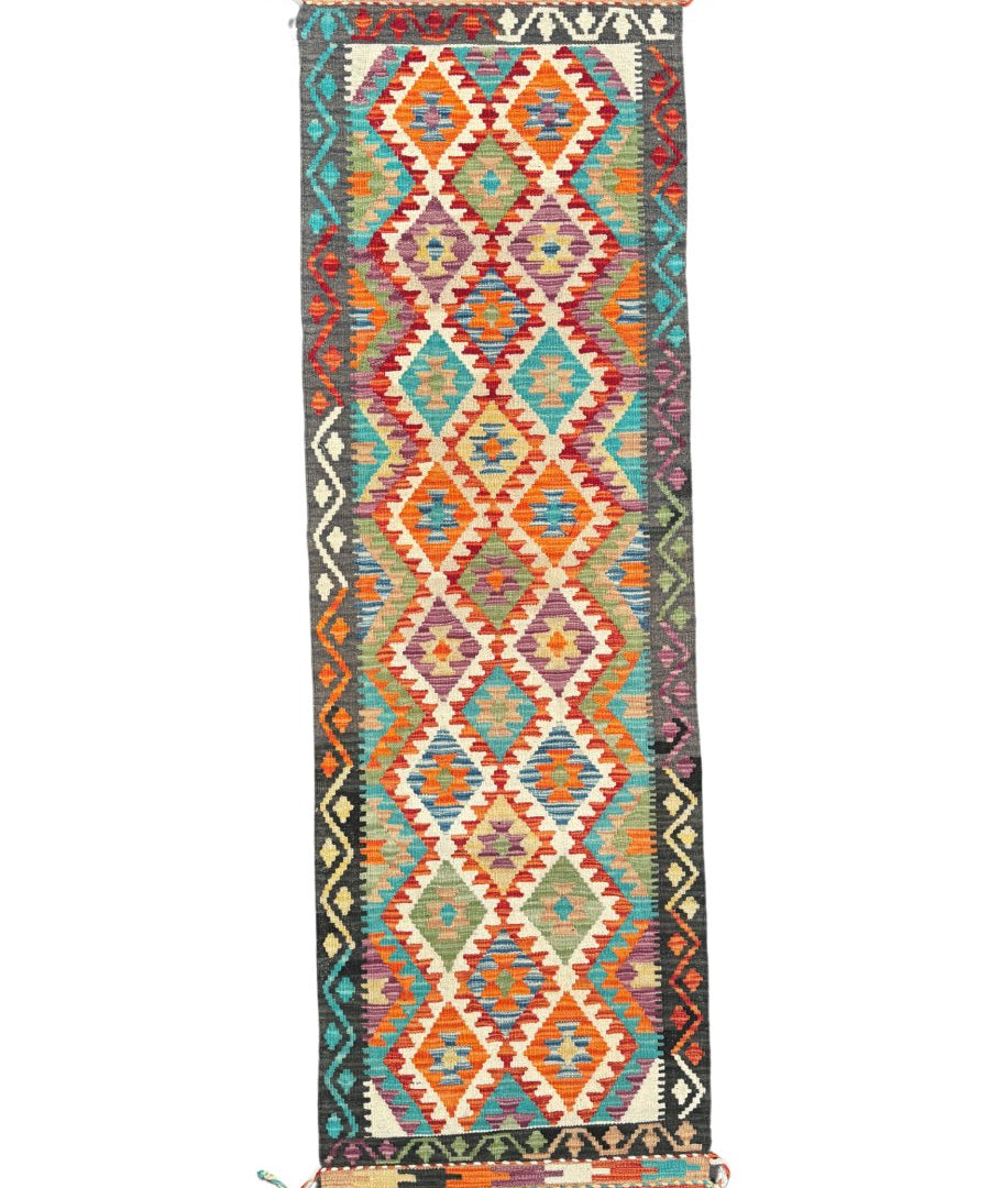 Kilim runner rug with geometric diamonds in teal, orange, red, and cream