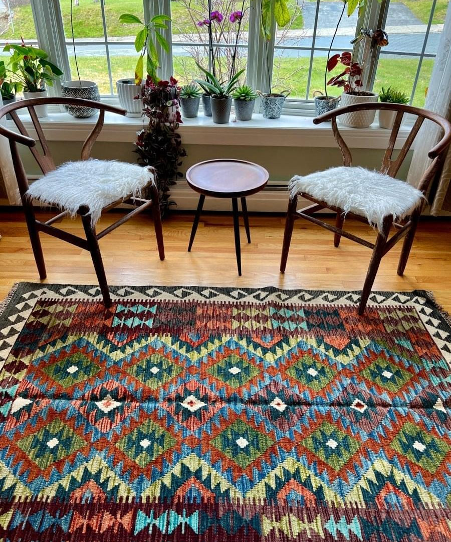 Afghan kilim rug with multicolor geometric diamond pattern and black border