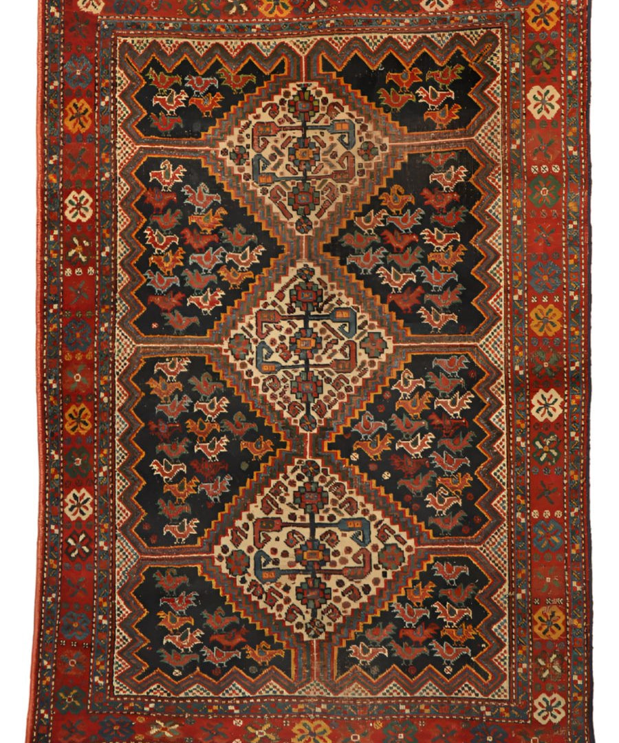 Antique Persian Khamseh rug with navy, red, and cream diamond medallions