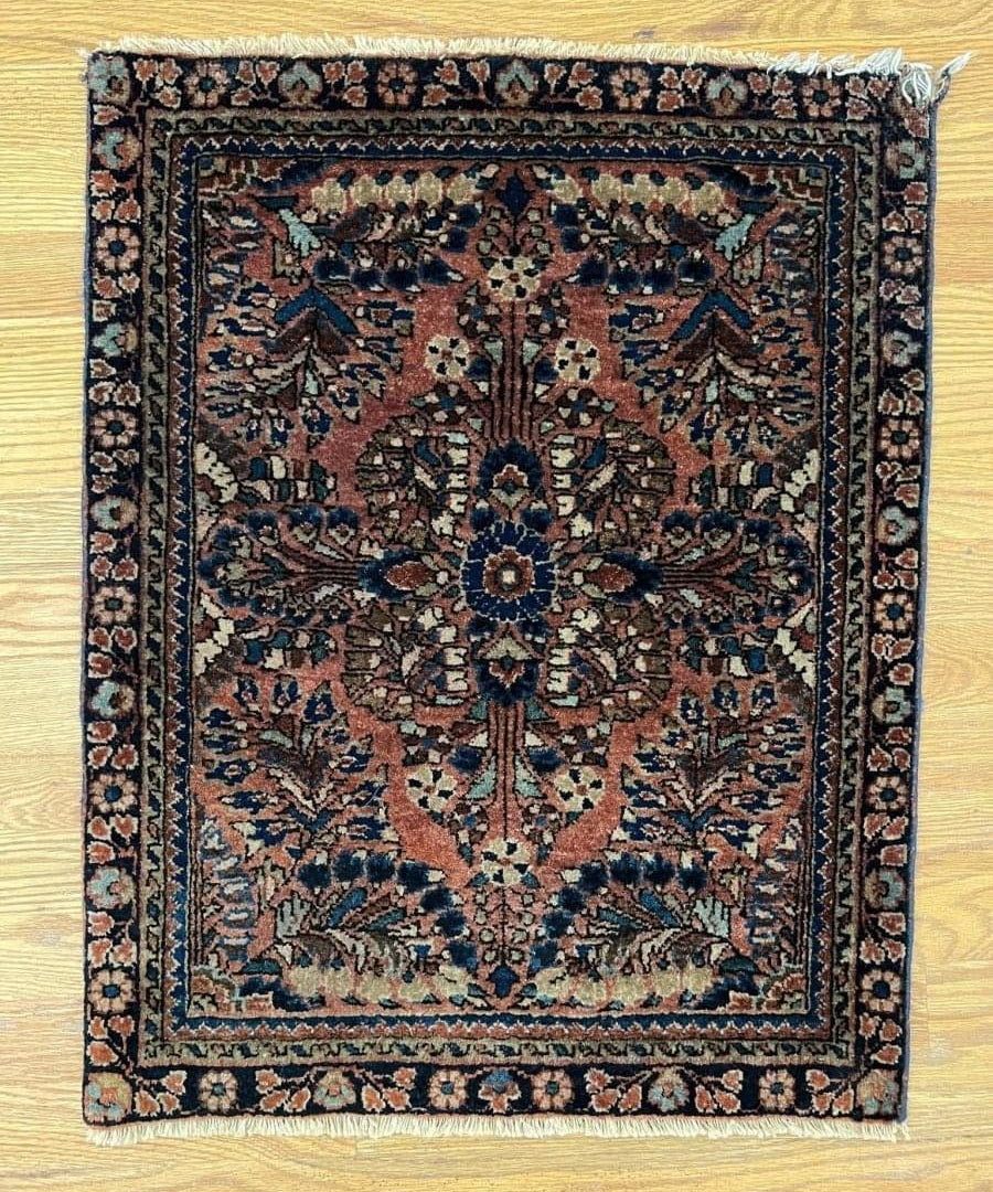 Antique Persian Sarouk rug, square medallion motif with dark navy border, rust and blue accents