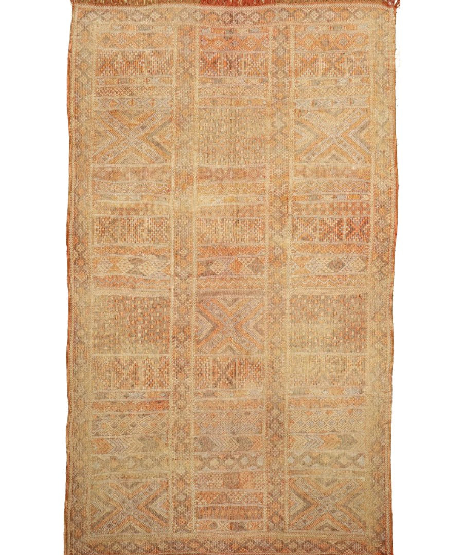 Moroccan woven rug, light tan geometric patchwork with red-brown fringe border