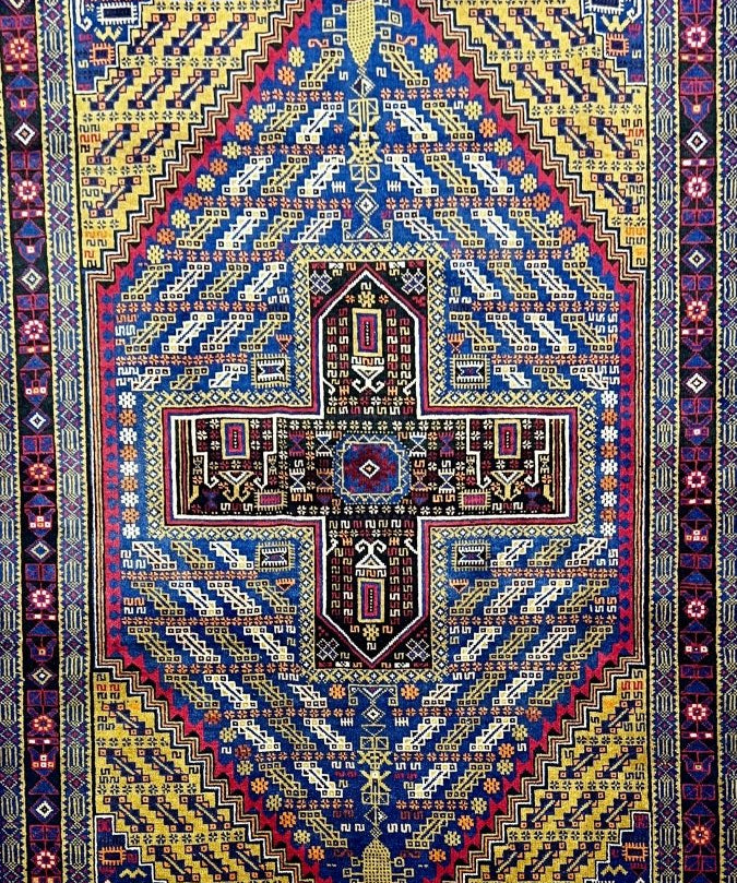Vintage Afghan Baluch rug with blue, yellow, red geometric medallion pattern