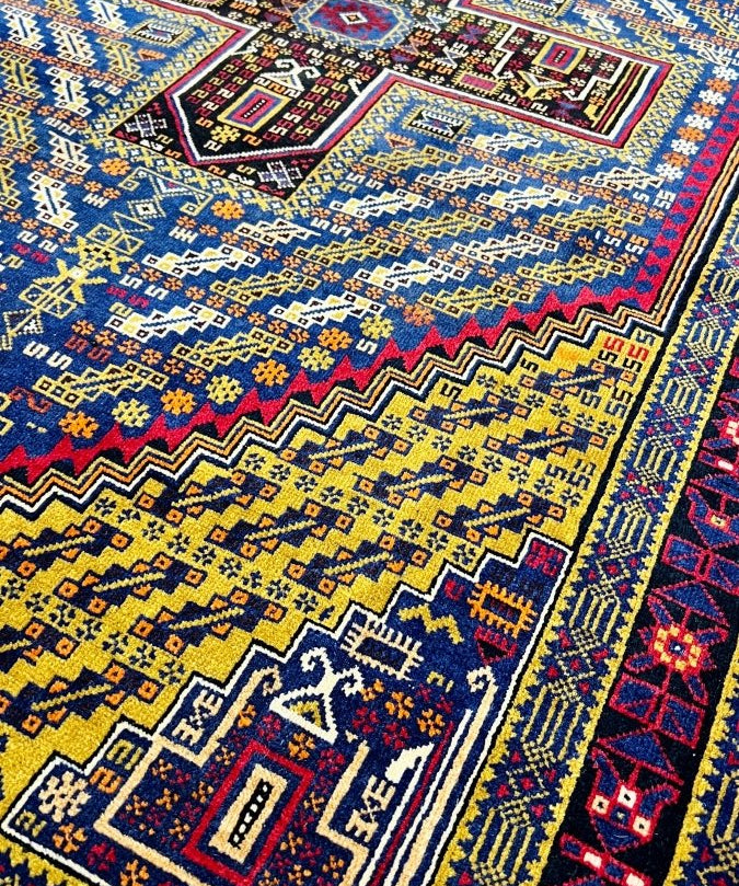 Vintage Afghan Baluch rug with multicolor border and central medallion