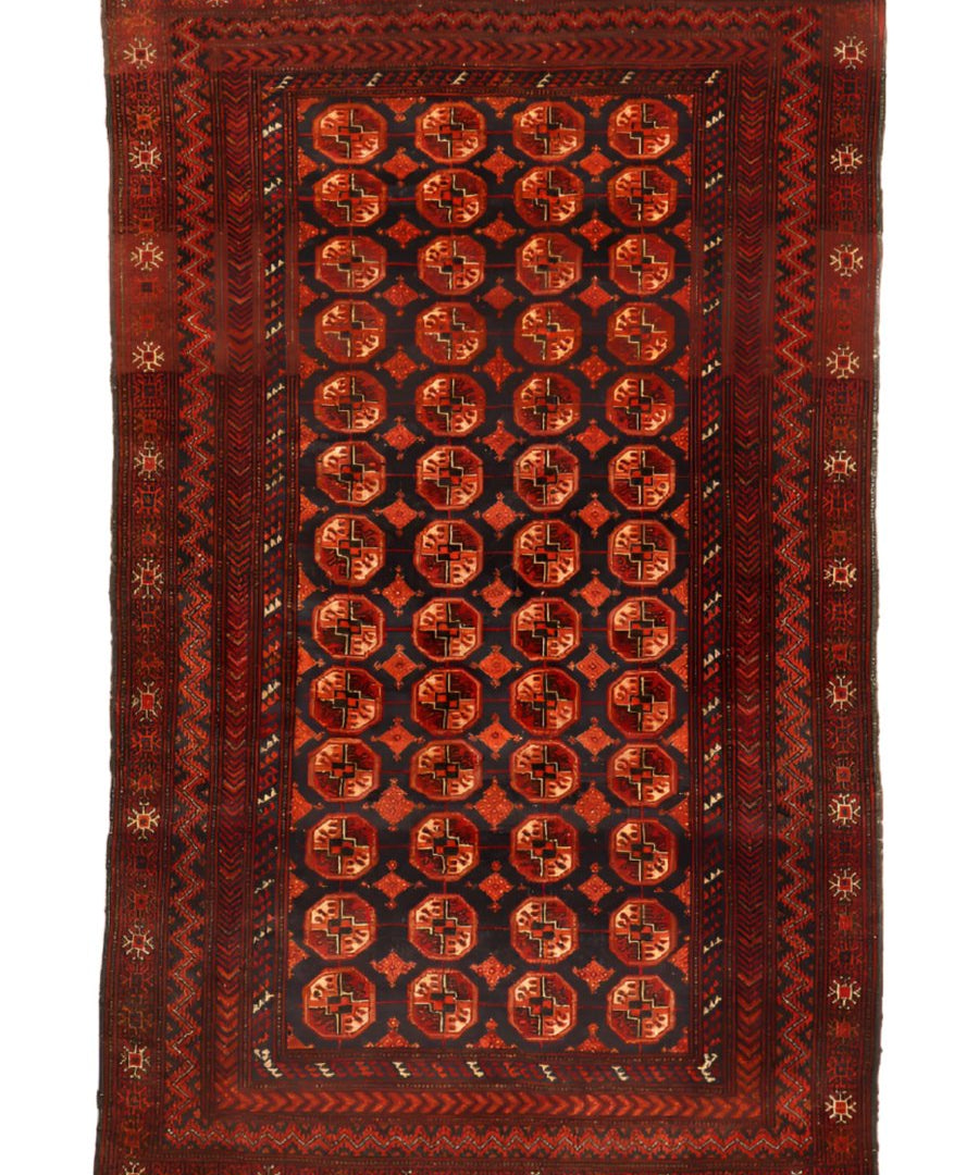 Baluch rug with dark red border and navy center medallion grid, decorative corner motifs