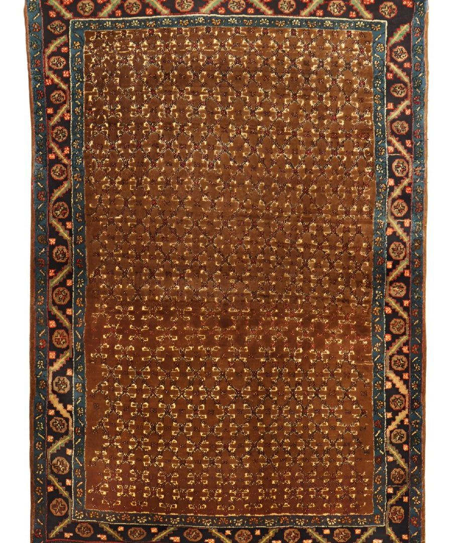 Persian Bidjar rug, brown field with dark blue border and repeating geometric motifs