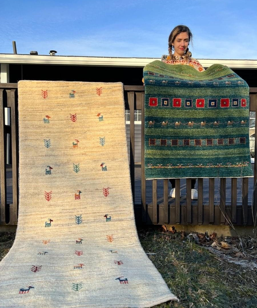 Light beige Gabbeh rug with scattered multicolor motifs, flat woven pattern