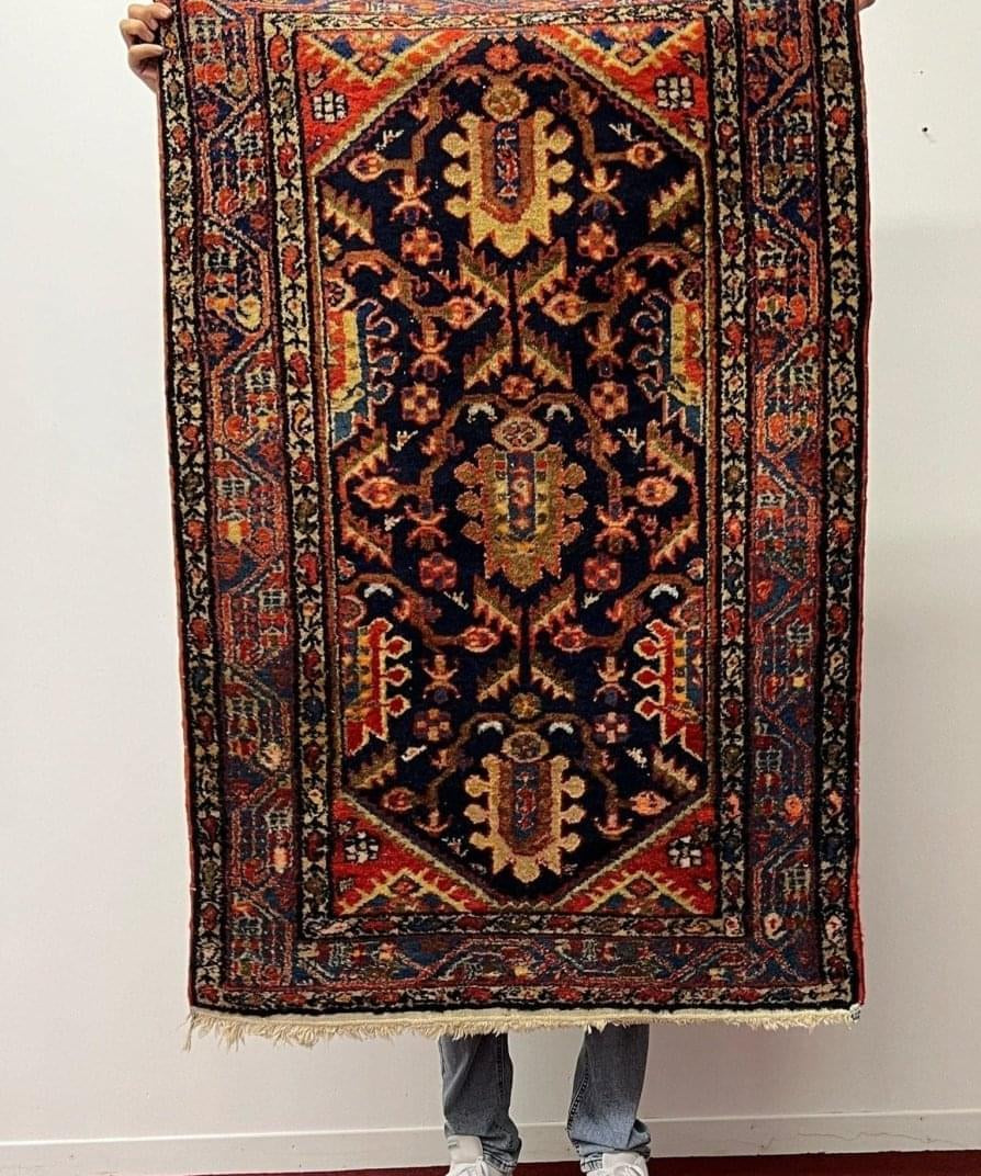 Persian Hamadan rug with dark navy field, red and rust medallion patterns
